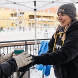 Volunteering to serve hot cocoa during a Marvin open skate event