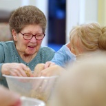 Marina, Senior Recreation and Well-Being Lead at Woodstock Residential Care Home, with a resident