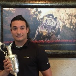 Holding the British Open trophy that was brought to the club by Zack Johnson