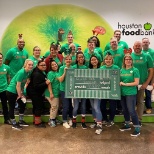 Reynolds associates volunteering at the Houston Food Bank.